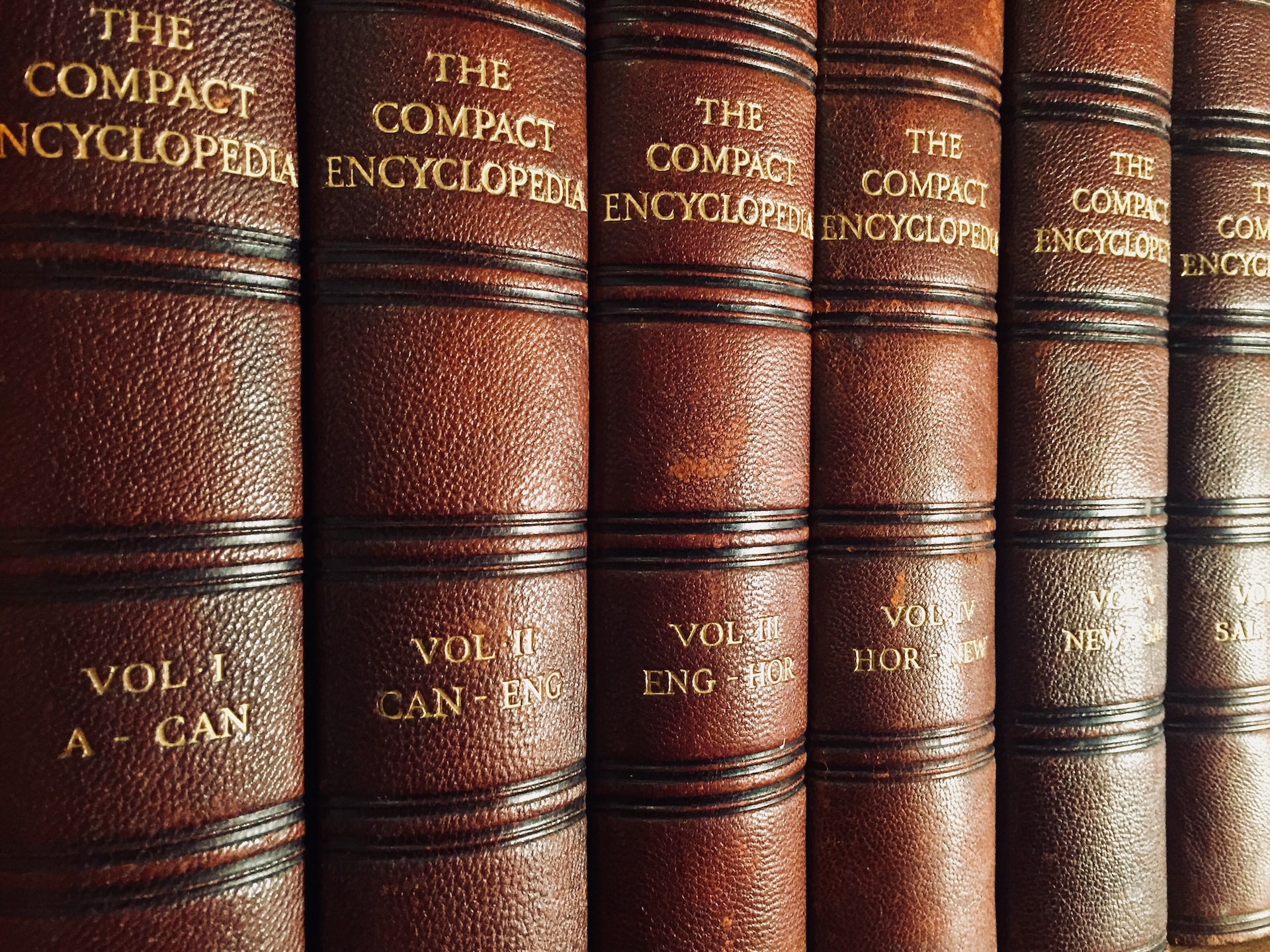 old encyclopedias in a bookshelf
